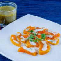 Borani Kado · Fried butternut pumpkin cooked in our special house made masala sauce. Topped with yogurt an...