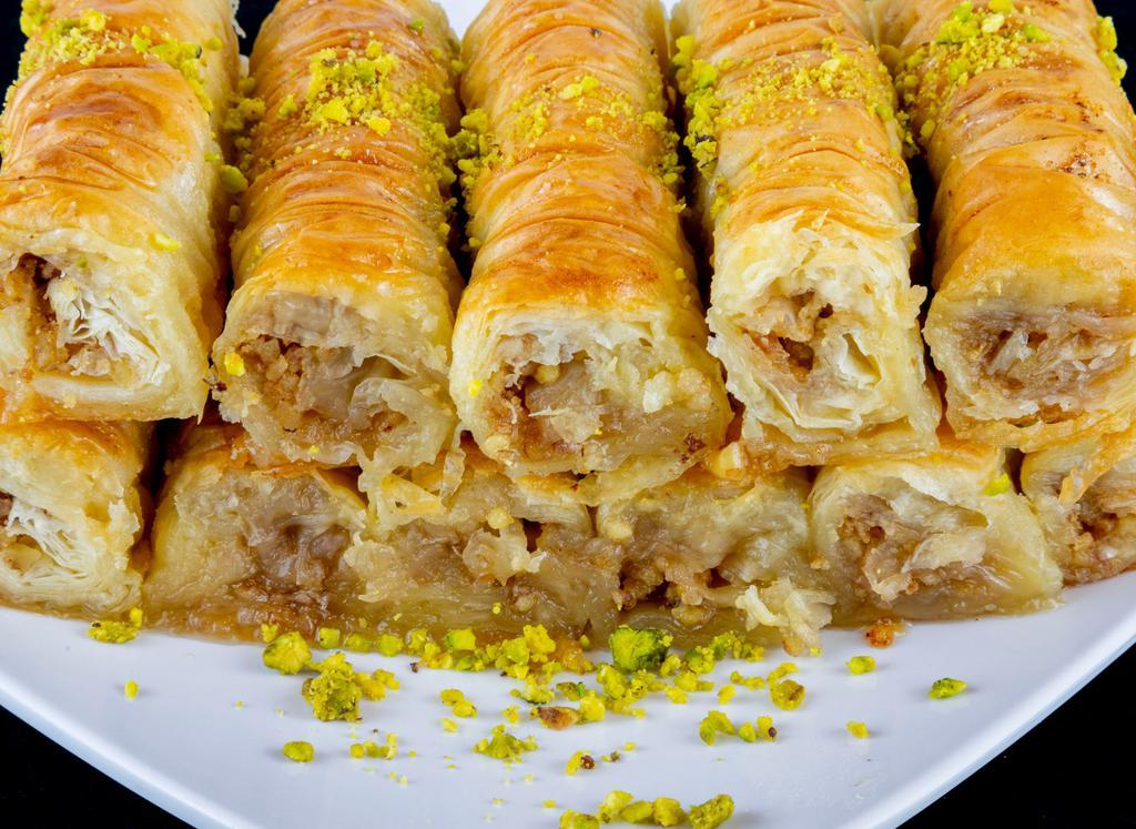 Baklava 2 pieces · Baklava is a rich, sweet pastry made of a layer of filo filled with chopped pistachio and walnut and sweetened and held together with syrup or honey.