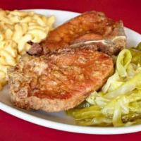 Fried Pork Chops · Two 6 oz. center-cut pork chops marinated in our special seasoning and fried to perfection.