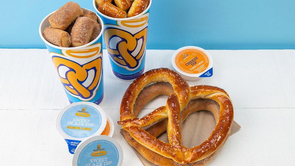 The Classics Snack Pack · The perfect snack for 2-4 people.. You get two 21 oz. cups of Original or Cinnamon Sugar Pretzel Nuggets, two Classic Pretzels of any flavor, and 4 dips of your choice.