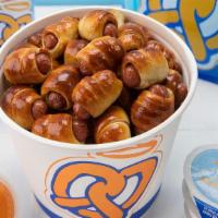 Mini Dogs Bucket Snack Pack · The perfect snack for 4-6 people. . You get a bucket filled with Mini Pretzel Dogs (50 piece...