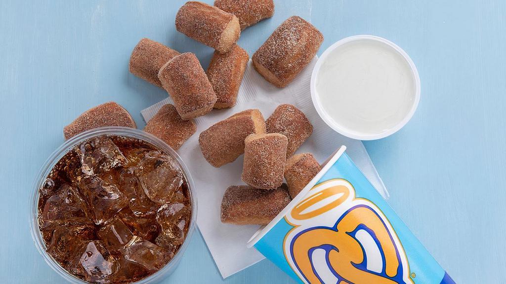 Regular Pretzel Nuggets Bundle · Choose between a Regular (21 oz.) size of Original or Cinnamon Sugar Nuggets paired with any dip, and a 21 oz. soft drink.
