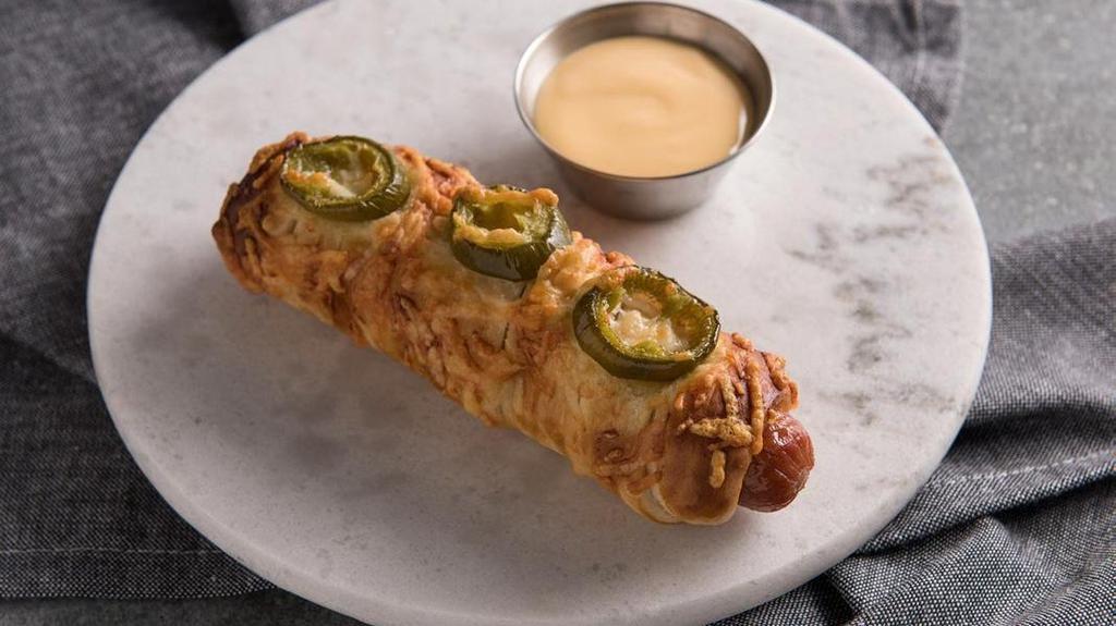 Jalapeno Cheese Pretzel Dog · A crispy three-cheese pretzel, topped with spicy jalapeño slices wrapped around a delicious Nathan’s Famous® hot dog, is a fresh look at the Pretzel Dog.