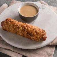 Cheese Pretzel Dog · An Auntie Anne’s Pretzel wrapped around a Nathan’s Famous® hot dog, topped with a simple thr...