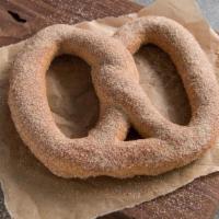 Cinnamon Sugar Pretzel · A pretzel hot from the oven, sprinkled with fresh cinnamon and sweet sugar.