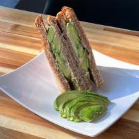 Avocado Toast · Plain Hummus on toasted wheat bread with Fresh Avocado and Tomato with Fresh Herb and Season...