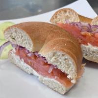 Lox Bagel (BreakFast) · Any Toasted Bagel, Cream Cheese, Red Onion, Tomato, & Tasty Premium Salmon.