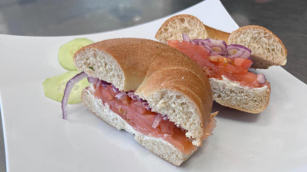 Lox Bagel (BreakFast) · Any Toasted Bagel, Cream Cheese, Red Onion, Tomato, & Tasty Premium Salmon.