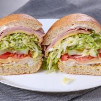 Mr. Happy · Black forest ham, turkey, havarti, and gouda. All sandwiches come with lettuce, tomatoes, re...