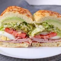 Green Eggs & Ham · Black forest ham, hard boiled eggs, avocado, and pesto. All sandwiches come with lettuce, to...