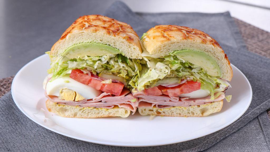 Green Eggs & Ham · Black forest ham, hard boiled eggs, avocado, and pesto. All sandwiches come with lettuce, tomatoes, red onions, pickles, pepperoncini, salt & pepper, house vinaigrette, and your choice of mayo and mustard.