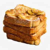 Banana French Toast · Two classic French toast topped with bananas and syrup on the side.