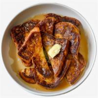 Classic French Toast · Two slices of bread dipped in egg, cream, cinnamon, and milk and grilled to perfection. Dust...