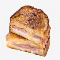 Ham, Egg, & Cheese French Toast Sandwich · Ham, fried egg, and Cheddar cheese sandwiched between two slices of classic French toast. Se...