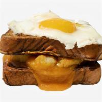 Potato, Egg, & Cheese French Toast Sandwich · Potatoes, fried egg, and Cheddar cheese sandwiched between two slices of classic French toas...