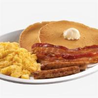 Classic Pancake Breakfast Combo · Two scrambled eggs, three fluffy pancakes with syrup, and your choice of meat and breakfast ...