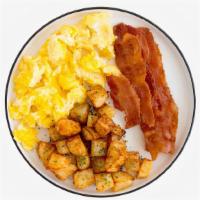 Classic Breakfast Combo · Two scrambled eggs with two slices of buttered toast, and your choice of meat and breakfast ...
