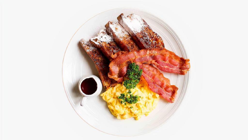 Classic French Toast Breakfast Combo · Two scrambled eggs, two slices of French toast, syrup, and your choice of meat and breakfast side.