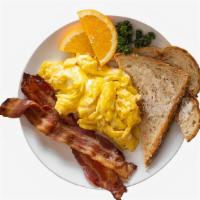 Simple Breakfast Combo · Two scrambled eggs with two slices of buttered toast and your choice of breakfast side.