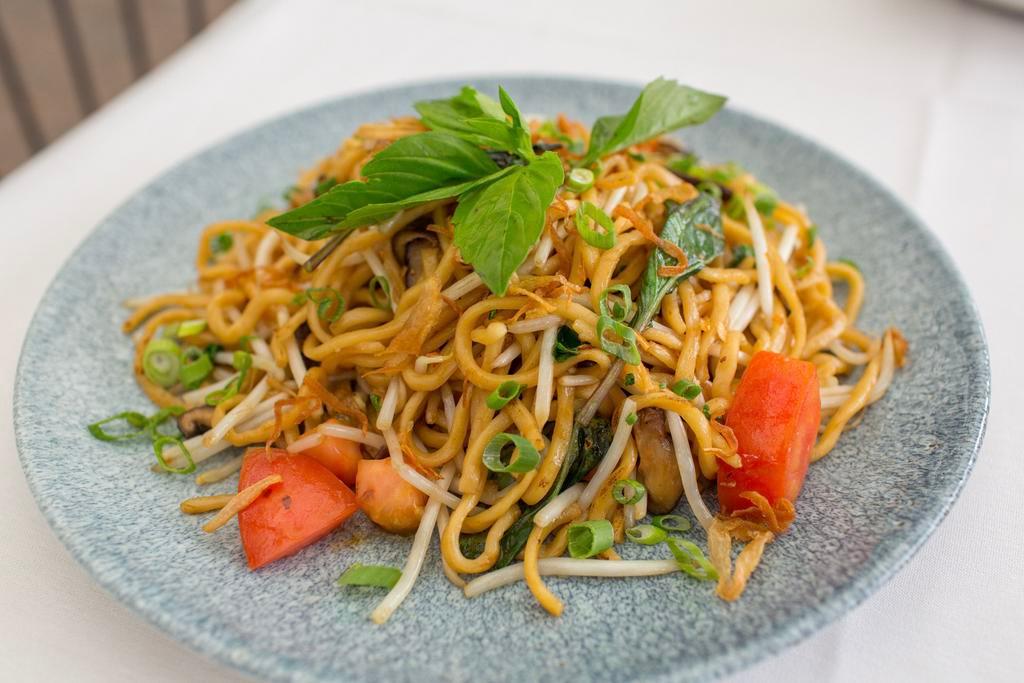 Garlic Noodles · wok fired egg noodles, shiitake mushrooms, tomatoes, thai basil, bean sprouts