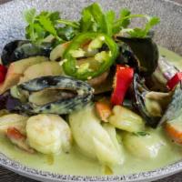 Seafood Green Curry · shrimp, fish, calamari, eggplant,  
bell peppers, spicy green curry