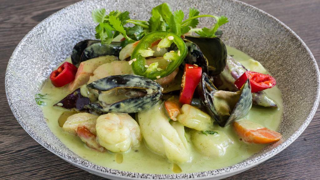 Seafood Green Curry · shrimp, fish, calamari, eggplant,  
bell peppers, spicy green curry