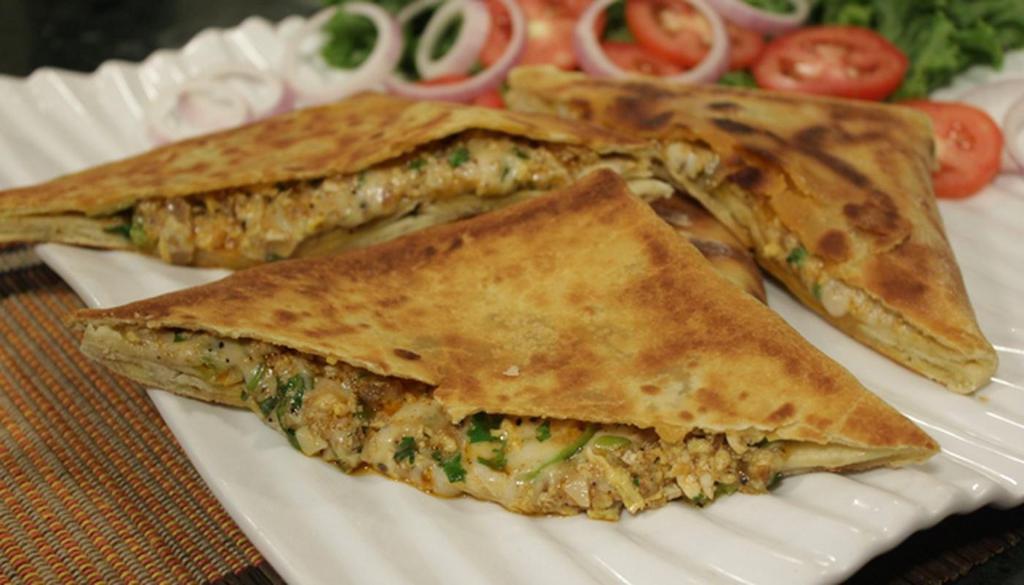 Roti with Chicken · Roti, filled with green onion and minced marinated chicken and served with  curry sauce