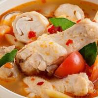 Tom Yum Chicken (L) · Spicy and sour chicken soup with assorted vegetables and herbs
