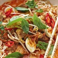 Malay Chicken Laksa Noodle Soup · Chicken, vegetables, noodles & puff tofu in Chef's special curry broth