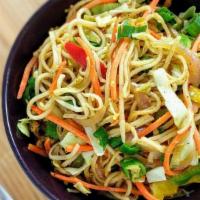 Veg Hakka Noodles · Street style hakka noodles served with green onions, bell peppers and cabbage