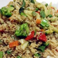 Veggie Basil Fried Rice · Stir fried rice with fresh thai chili, peas, carrots and tofu