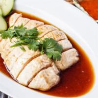 Hainan Chicken · Chicken boiled with malay spices, served with yellow rice and spice ginger sauce on the side