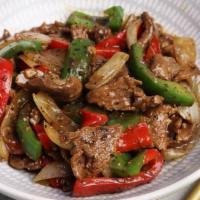 Miri Beef · Sliced beef with black pepper, eggplant, string beans and curry leaves