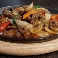 Penang Sizzling Beef · Stir-fried beef in spicy brown sauce with lemongrass, chili and spices