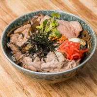 Gyudon · Thinly sliced kobe beef, cooked in sweet ginger soy sauce with onions, served over rice topp...