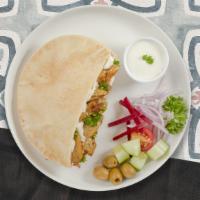 Chicken Shawarma Wrap  · Wrapped with lavash bread, hummus, babaganoush, salata and tahini sauce.