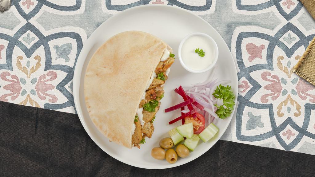 Chicken Shawarma Wrap  · Wrapped with lavash bread, hummus, babaganoush, salata and tahini sauce.