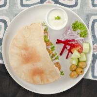 Falafel Wrap  · Wrapped with lavash bread, hummus, babaganoush, salata and tahini sauce.