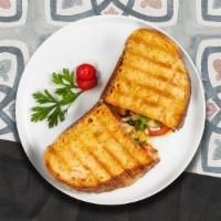 Grilled Chicken Panini  · Grilled chicken, melted cheese, lettuce, and tomato served on your choice of toasted bread.
