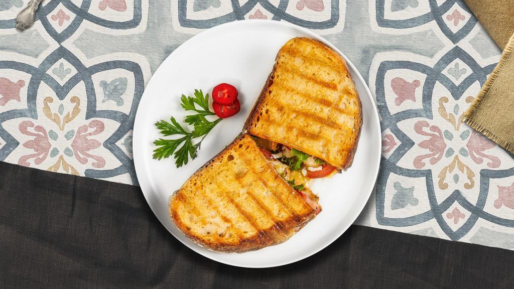 Grilled Chicken Panini  · Grilled chicken, melted cheese, lettuce, and tomato served on your choice of toasted bread.