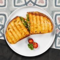 Chicken Pesto Panini  · Chicken, melted cheese, pesto, lettuce and tomato served on your choice of toasted bread.
