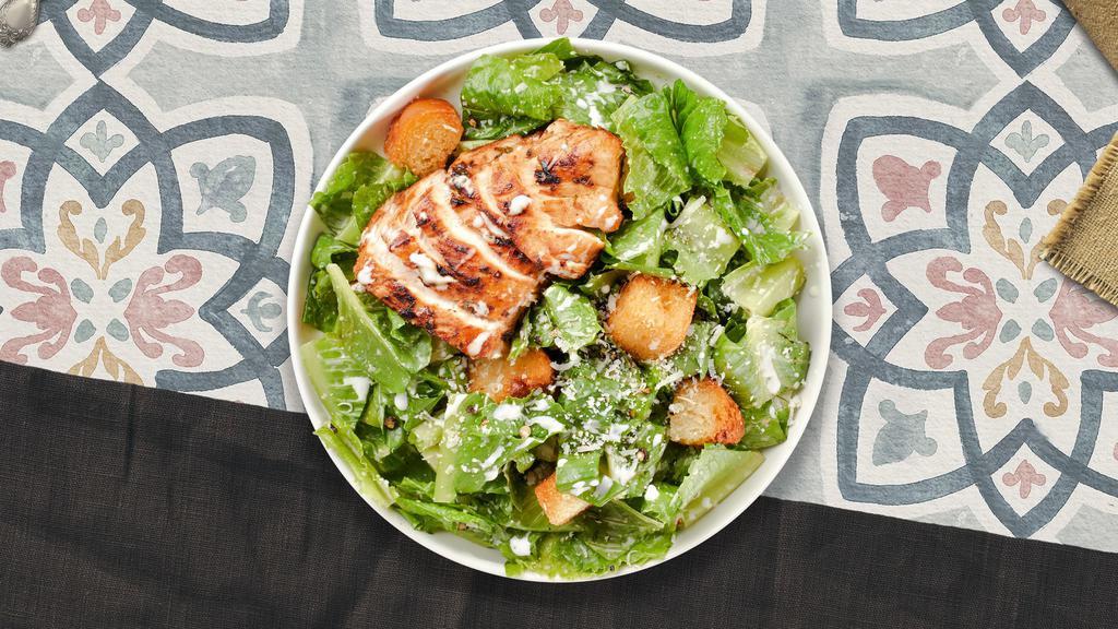 Chicken Caesar Salad  · Romaine lettuce, grilled chicken, house croutons, and parmesan cheese tossed with caesar dressing.