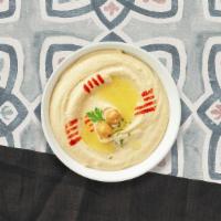 Hummus With Pita · A mixture of mashed garbanzo beans, lemon juice and tahini, and garlic served with pita bread.