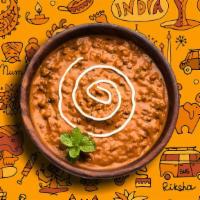 Daal Black Knight · Black lentils slow cooked till tender and tempered with Indian spices and finished with fres...