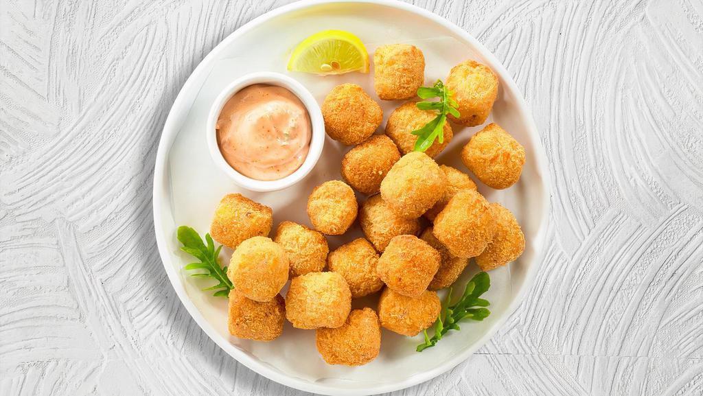 Tator Tots  · Shredded Idaho potatoes formed into tots, battered, and fried until golden brown. Served with your choice of sauce. Vegetarian.