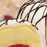 Exotic Bomba · Mango, passion fruit and raspberry sorbetto 
all covered in white chocolate and drizzled 
wi...