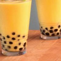 Mango Tango Tea · Mango milk tea with non-dairy cream.