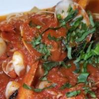 Cioppino with Pasta · Shrimp, calamari, clams, mussels, king crab legs, scallops in marinara sauce.