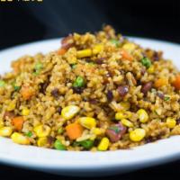 Cajun Fried RIce · Jasmine rice with sweet corn and diced Louisiana Hot Links stir fried in House Cajun flavoring