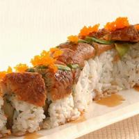 Dragon Roll · Out: unagi, avocado, masago, & unagi sauce; in: crab & shrimp tempura.